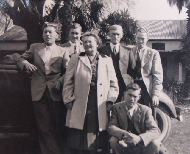 China Marais (on the left), with his parents and brothers in front of their home in Paarl